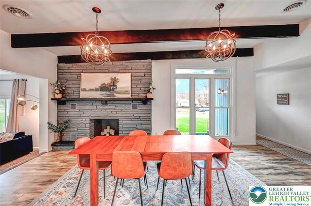 134 Altemose Rd, Tobyhanna Twp, PA 18347 - dining room featuring an inviting chandelier, beam ceiling, visible vents, and a wealth of natural light