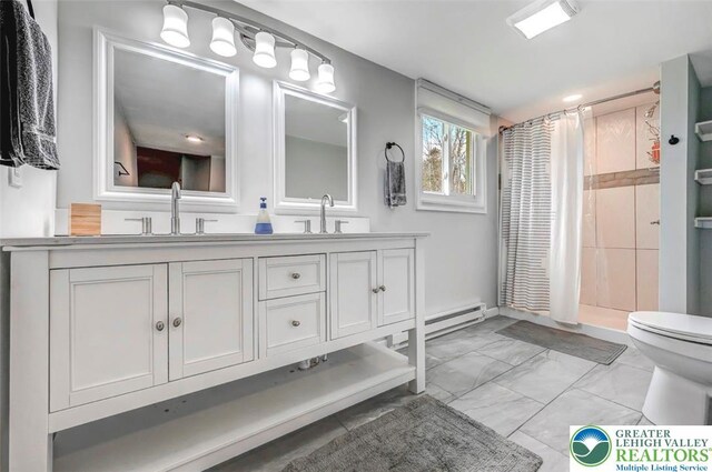 134 Altemose Rd, Tobyhanna Twp, PA 18347 - bathroom with double vanity, a shower stall, a sink, toilet, and marble finish floor