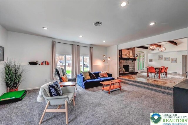 134 Altemose Rd, Tobyhanna Twp, PA 18347 - living room featuring carpet flooring, a notable chandelier, a stone fireplace, recessed lighting, and visible vents