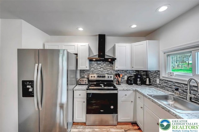 134 Altemose Rd, Tobyhanna Twp, PA 18347 - kitchen with wall chimney range hood, backsplash, light countertops, a sink, and stainless steel appliances