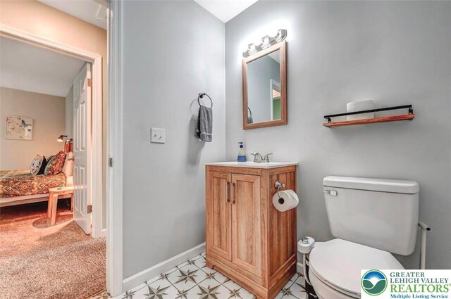 134 Altemose Rd, Tobyhanna Twp, PA 18347 - bathroom featuring baseboards, vanity, and toilet
