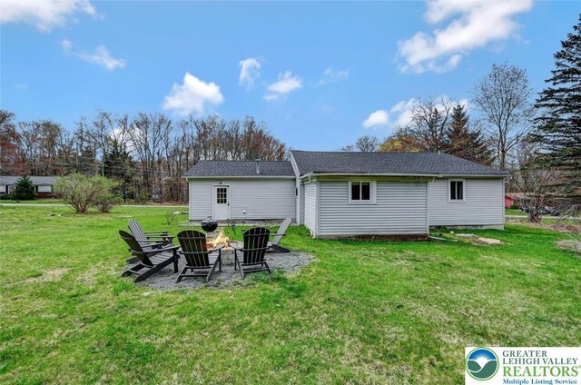 134 Altemose Rd, Tobyhanna Twp, PA 18347 - rear view of property with a yard and an outdoor fire pit