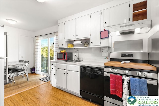 kitchen featuring dishwasher, light countertops, electric stove, white cabinetry, and under cabinet range hood