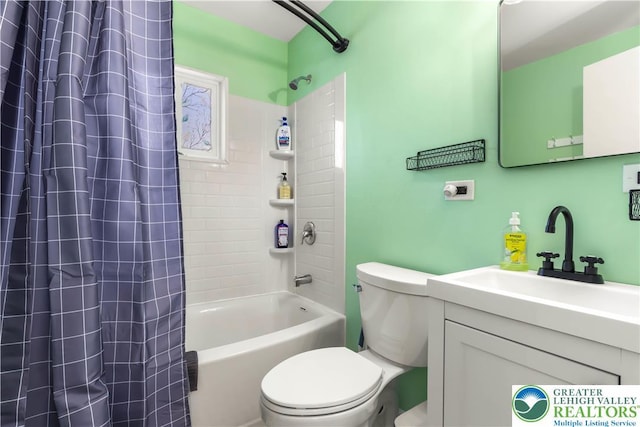 full bathroom featuring toilet, shower / tub combo, and vanity