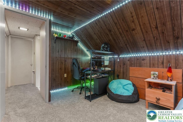 bonus room with vaulted ceiling, wood walls, and carpet
