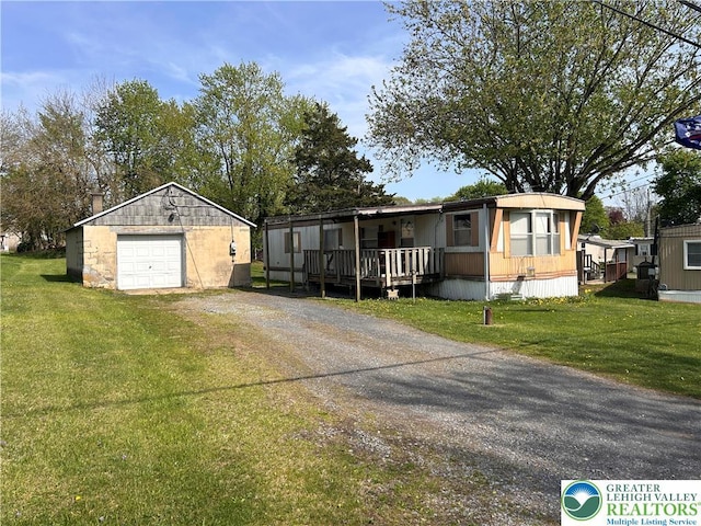 2845 Pacific Ave, North Whitehall Twp, PA 18069 - manufactured / mobile home featuring a garage, dirt driveway, an outdoor structure, and a front lawn