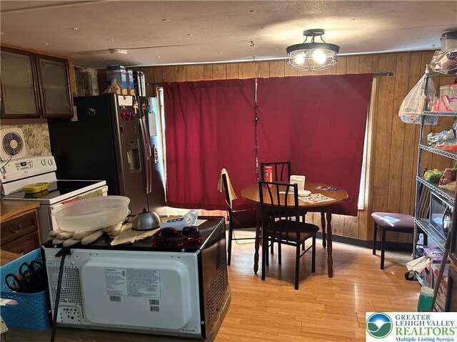 2845 Pacific Ave, North Whitehall Twp, PA 18069 - dining room with wood walls and light wood-style flooring