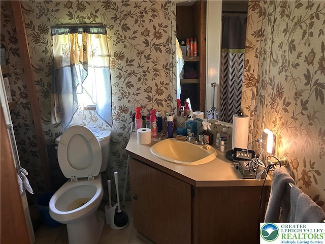 2845 Pacific Ave, North Whitehall Twp, PA 18069 - bathroom with vanity, tile patterned flooring, toilet, and wallpapered walls