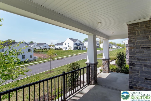 view of patio with a residential view and covered porch