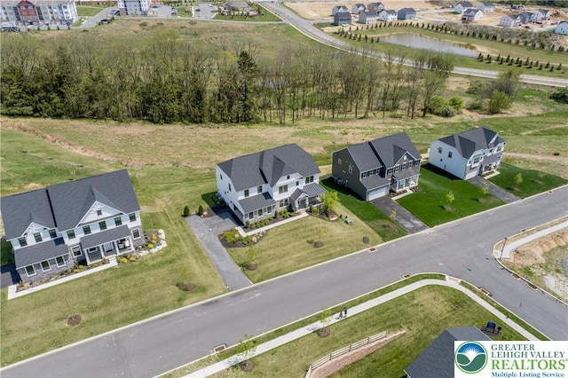 bird's eye view featuring a water view and a residential view