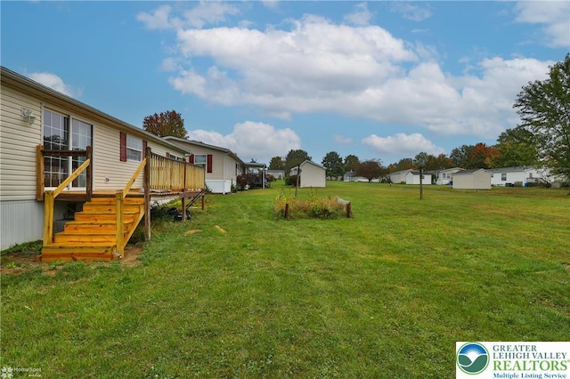 view of yard with a wooden deck