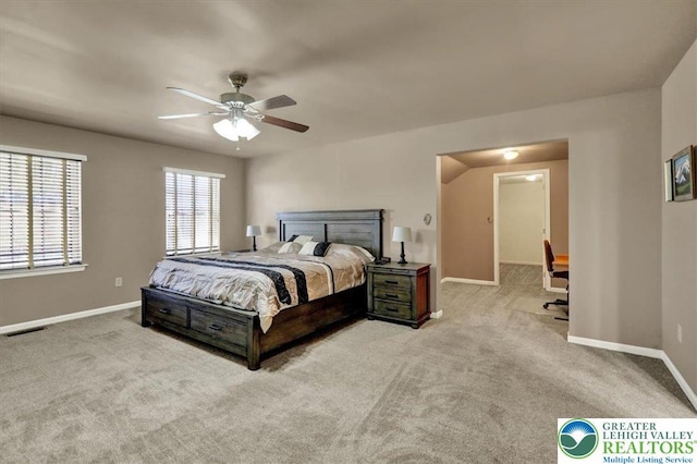 carpeted bedroom with baseboards, visible vents, and ceiling fan