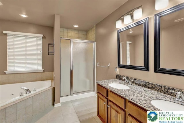full bathroom with a sink, tile patterned flooring, a whirlpool tub, and a stall shower