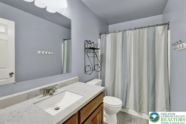 bathroom featuring vanity, curtained shower, toilet, and wood finished floors