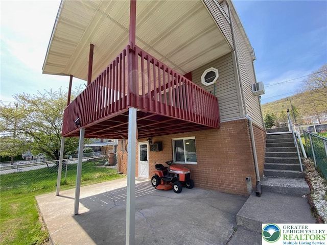 exterior space featuring fence and a deck