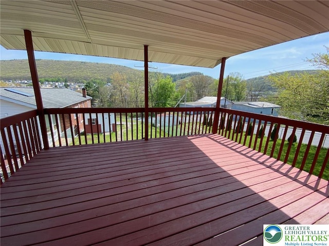 deck featuring a forest view