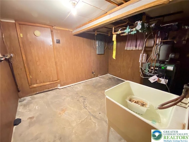 unfinished below grade area featuring a sink and electric panel
