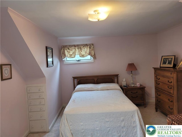 bedroom with baseboards, light colored carpet, and ornamental molding