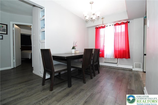 dining room with an inviting chandelier, baseboards, wood finished floors, a baseboard radiator, and visible vents