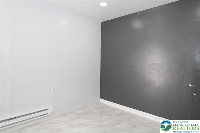 unfurnished room with recessed lighting, a baseboard radiator, marble finish floor, and baseboards