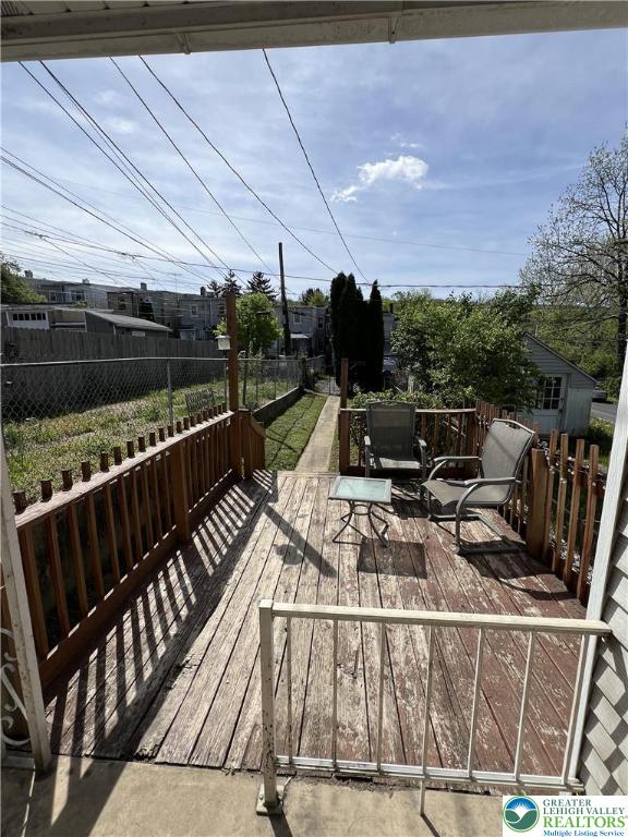 wooden deck featuring fence
