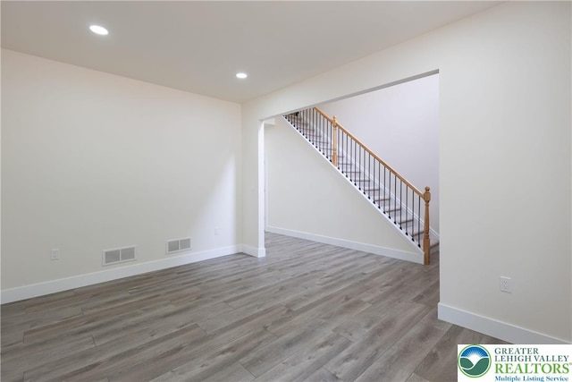 21 Piute Trl, Penn Forest Township, PA 18210 - unfurnished room featuring stairs, wood finished floors, baseboards, and recessed lighting