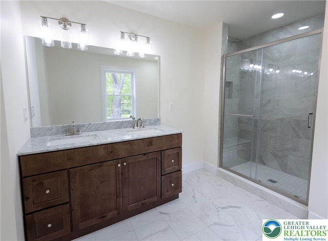 21 Piute Trl, Penn Forest Township, PA 18210 - bathroom with marble look tile flooring, a shower stall, baseboards, double vanity, and recessed lighting