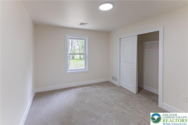 21 Piute Trl, Penn Forest Township, PA 18210 - unfurnished bedroom with light carpet, baseboards, and a closet