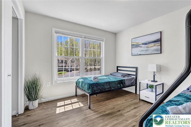 511 Lakeside Dr, Stroud Twp, PA 18301 - bedroom with baseboards and wood finished floors