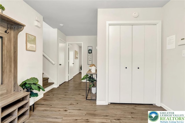 511 Lakeside Dr, Stroud Twp, PA 18301 - entryway with baseboards, wood finished floors, and stairway