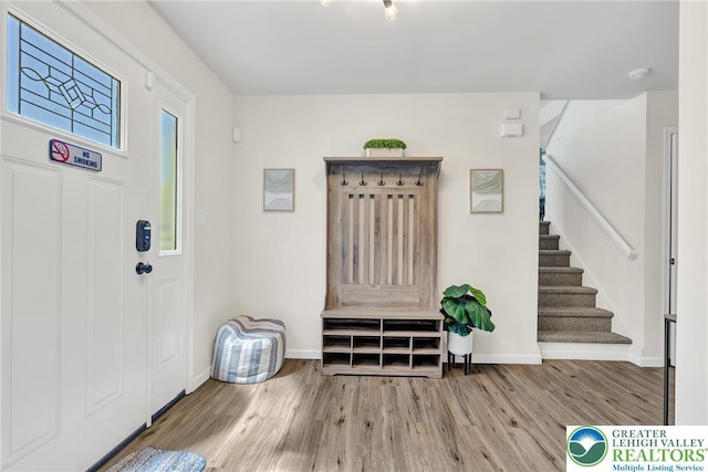 511 Lakeside Dr, Stroud Twp, PA 18301 - foyer entrance featuring stairway, baseboards, and wood finished floors