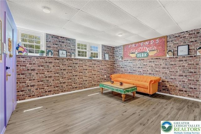 511 Lakeside Dr, Stroud Twp, PA 18301 - playroom with baseboards, plenty of natural light, a drop ceiling, and brick wall