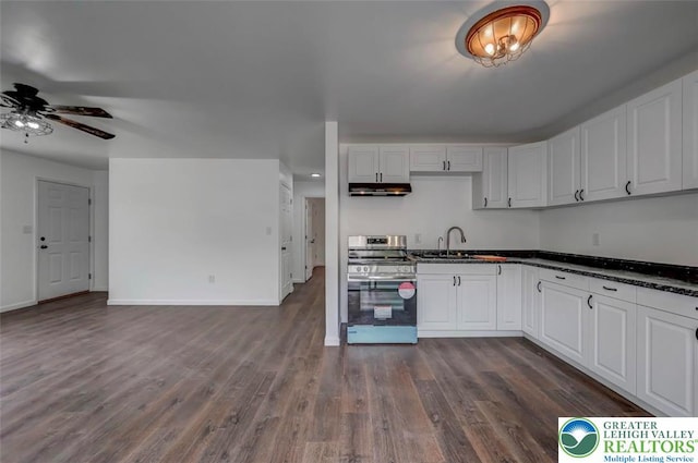 kitchen with under cabinet range hood, white cabinets, a ceiling fan, dark wood finished floors, and stainless steel electric range oven