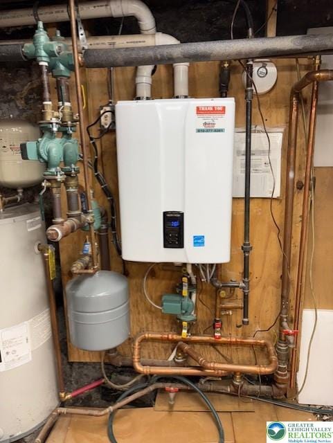 utility room featuring water heater