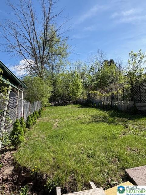 view of yard featuring fence