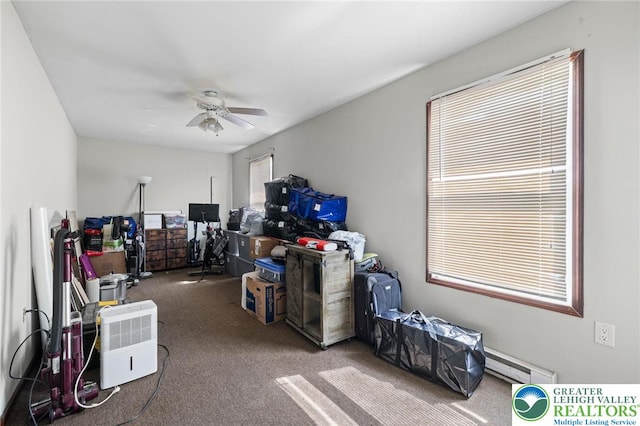 storage area featuring a baseboard radiator and a ceiling fan
