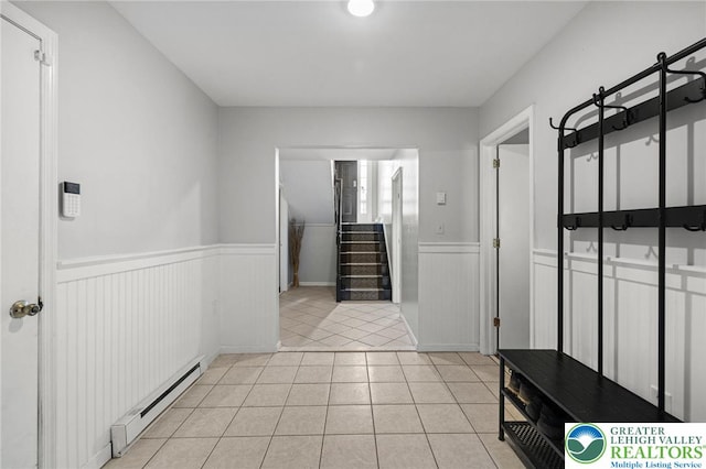 bathroom featuring a baseboard radiator, wainscoting, and tile patterned floors