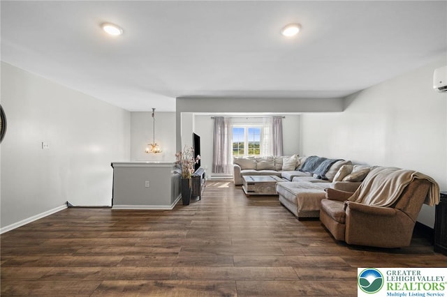 living area featuring baseboards, recessed lighting, and dark wood finished floors