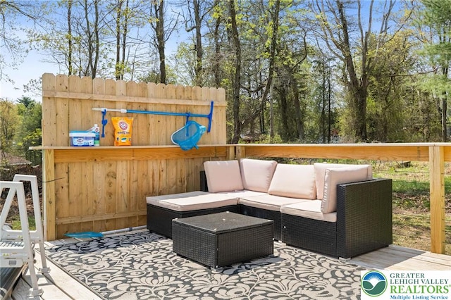 wooden deck featuring an outdoor hangout area