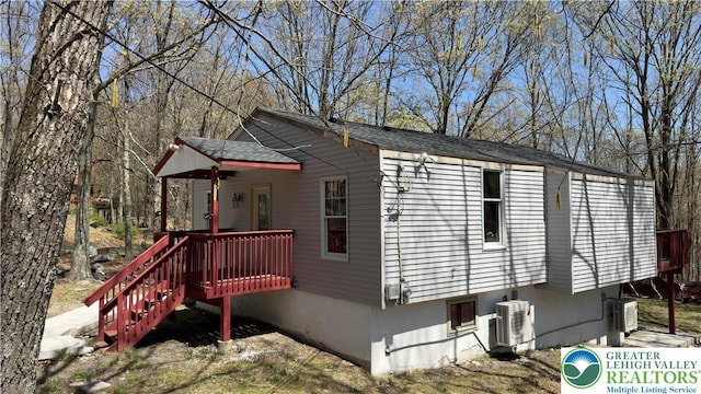 194 Murphy Cir, Lehman Twp, PA 18324 - view of property exterior with ac unit, a wooden deck, and stairway