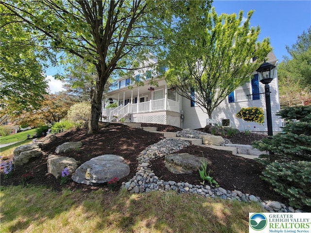 5474 Ashley Dr, North Whitehall Twp, PA 18059 - view of property exterior featuring a porch and stairway
