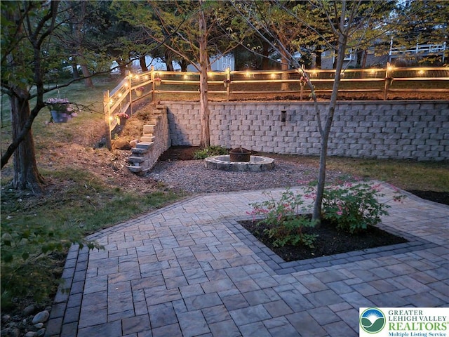 view of yard with a patio, a fire pit, and a fenced backyard