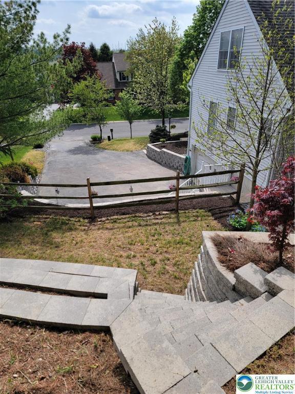 view of property's community with fence