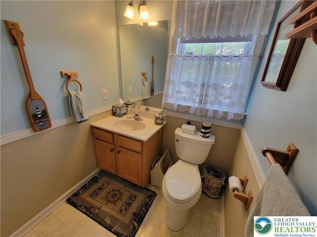 half bath with vanity and toilet