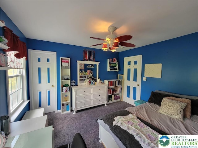 bedroom featuring a ceiling fan and carpet