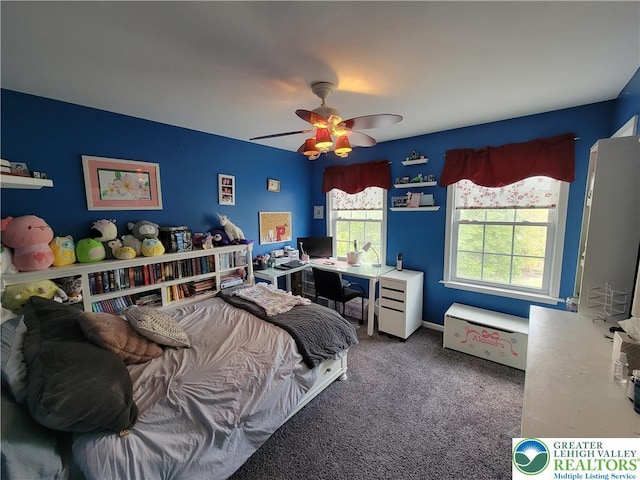 bedroom with a ceiling fan and carpet flooring