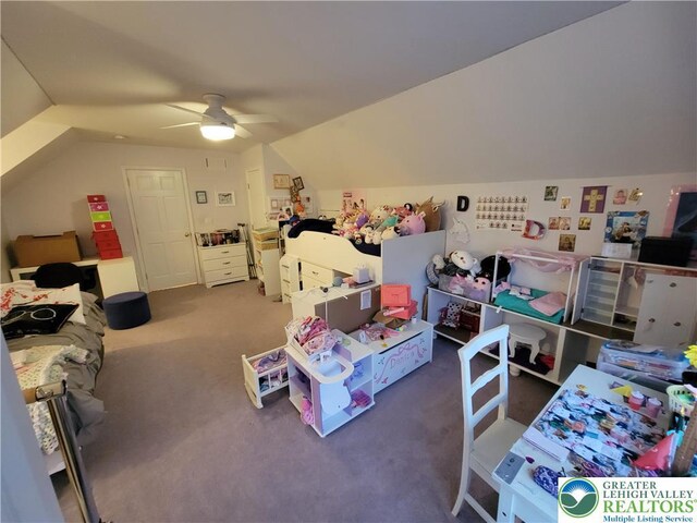 recreation room with carpet floors, ceiling fan, and vaulted ceiling