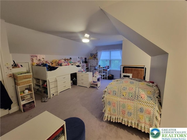 carpeted bedroom with a ceiling fan and lofted ceiling