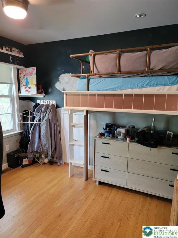 bedroom featuring light wood-style floors
