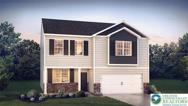 313 Knollwood Dr, Forks Twp, PA 18040 - view of front of home featuring an attached garage, a lawn, driveway, and stone siding